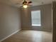 Well lit bedroom with ceiling fan and tile floors at 3236 White Blossom Ln, Clermont, FL 34711