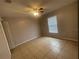 Bright bedroom with ceiling fan and tile floors at 3236 White Blossom Ln, Clermont, FL 34711