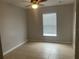 Spacious bedroom featuring tile floors and a window with blinds at 3236 White Blossom Ln, Clermont, FL 34711