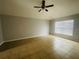 Bright bedroom with tile floors and ceiling fan at 3236 White Blossom Ln, Clermont, FL 34711