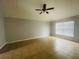 Large bedroom with ceiling fan and tile floors at 3236 White Blossom Ln, Clermont, FL 34711