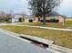 House exterior view, showcasing front yard and street at 3236 White Blossom Ln, Clermont, FL 34711