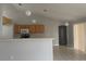 Bright kitchen with light wood cabinets and an island at 3236 White Blossom Ln, Clermont, FL 34711