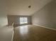 Bright living room with vaulted ceilings and tile floors at 3236 White Blossom Ln, Clermont, FL 34711