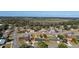 Aerial view of a residential neighborhood with single-Gathering homes and lush greenery at 3437 Starfish Ave, Fruitland Park, FL 34731