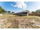 Large backyard with brick home and screened porch at 3437 Starfish Ave, Fruitland Park, FL 34731