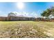 Large backyard with brick home and screened porch at 3437 Starfish Ave, Fruitland Park, FL 34731