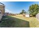 Large backyard with shed and wooden fence at 3437 Starfish Ave, Fruitland Park, FL 34731