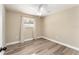 Bright bedroom featuring vinyl flooring and window coverings at 3437 Starfish Ave, Fruitland Park, FL 34731