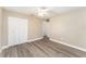 Bedroom with double door closet and vinyl flooring at 3437 Starfish Ave, Fruitland Park, FL 34731