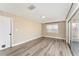 Bright living room with vinyl flooring and sliding glass doors at 3437 Starfish Ave, Fruitland Park, FL 34731