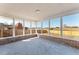 Screened porch with view of backyard and trees at 3437 Starfish Ave, Fruitland Park, FL 34731