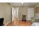 Cozy bedroom with hardwood floors, a ceiling fan, and closet, creating a comfortable and inviting atmosphere at 36703 Sandy Ln, Grand Island, FL 32735