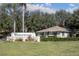 Community building with Wedgewood sign and American flag at 36703 Sandy Ln, Grand Island, FL 32735