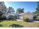 Brick, single-story home with attached garage and landscaping at 36703 Sandy Ln, Grand Island, FL 32735