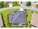 Aerial view of a house with a large backyard and screened enclosure at 3795 View Path, The Villages, FL 32163