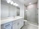 Modern bathroom with quartz countertop and glass shower at 3951 Kennebunk Loop, Mount Dora, FL 32757