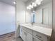 Modern bathroom vanity with quartz countertop and white cabinets at 3951 Kennebunk Loop, Mount Dora, FL 32757