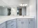 Modern bathroom vanity with quartz countertop and white cabinets at 3951 Kennebunk Loop, Mount Dora, FL 32757