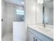 Bathroom with a walk-in shower and modern vanity at 3951 Kennebunk Loop, Mount Dora, FL 32757