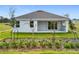 Single story home with backyard and landscaping at 3951 Kennebunk Loop, Mount Dora, FL 32757