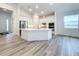 Modern kitchen with island, stainless steel appliances, and white cabinets at 3951 Kennebunk Loop, Mount Dora, FL 32757