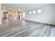 Bright living room with open floor plan and hardwood floors at 3951 Kennebunk Loop, Mount Dora, FL 32757