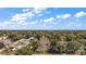 Aerial view of house and surrounding neighborhood at 401 Cherry Tree St, Eustis, FL 32726