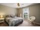 Charming bedroom featuring a comfortable bed and a ceiling fan at 401 Cherry Tree St, Eustis, FL 32726