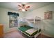 bedroom with a bunk bed and cheerful decor at 401 Cherry Tree St, Eustis, FL 32726