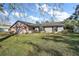 Single story home with brick facade and yard at 401 Cherry Tree St, Eustis, FL 32726