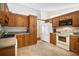 Well-equipped kitchen featuring wood cabinets and ample counter space at 401 Cherry Tree St, Eustis, FL 32726