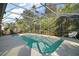 Relaxing screened-in pool with plenty of space for lounging at 401 Cherry Tree St, Eustis, FL 32726