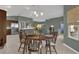 Dining area with a view into the kitchen and living areas at 4063 Deskin Ln, The Villages, FL 32163