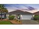 Attractive single-story home with a landscaped front yard and two-car garage at 4063 Deskin Ln, The Villages, FL 32163