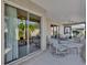 Screened patio with lounge chairs and sliding glass doors at 4063 Deskin Ln, The Villages, FL 32163