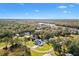 Aerial view of a home nestled in a quiet neighborhood near a river at 4777 Cr 306A, Lake Panasoffkee, FL 33538