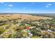 Aerial view showing the home's location near a river and open fields at 4777 Cr 306A, Lake Panasoffkee, FL 33538