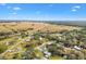 Aerial view of home and surrounding area near river and open fields at 4777 Cr 306A, Lake Panasoffkee, FL 33538