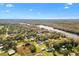 Aerial view showcasing a house's serene riverside setting at 4777 Cr 306A, Lake Panasoffkee, FL 33538