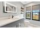 Contemporary bathroom with a floating vanity and large mirror at 4777 Cr 306A, Lake Panasoffkee, FL 33538