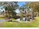 Serene waterfront property with dock and lush foliage at 4777 Cr 306A, Lake Panasoffkee, FL 33538