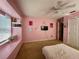 Pink bedroom with window seat and decor at 5036 Gandross Ln, Mount Dora, FL 32757