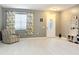 Bright living room with light wood floors and a coat rack at 5036 Gandross Ln, Mount Dora, FL 32757