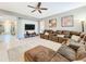 Relaxing living room with sectional sofa and large TV at 5036 Gandross Ln, Mount Dora, FL 32757