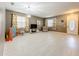 Spacious living room with light wood floors and a large window at 5036 Gandross Ln, Mount Dora, FL 32757