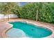 Relaxing kidney-shaped pool, perfect for summer enjoyment at 5036 Gandross Ln, Mount Dora, FL 32757