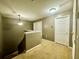 Upstairs hallway with neutral carpeting and doors to bedrooms at 5036 Gandross Ln, Mount Dora, FL 32757