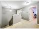 Upstairs hallway with carpet and doors to bedrooms at 5036 Gandross Ln, Mount Dora, FL 32757