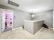 Upstairs hallway with doors to bedrooms and a view of a bedroom at 5036 Gandross Ln, Mount Dora, FL 32757